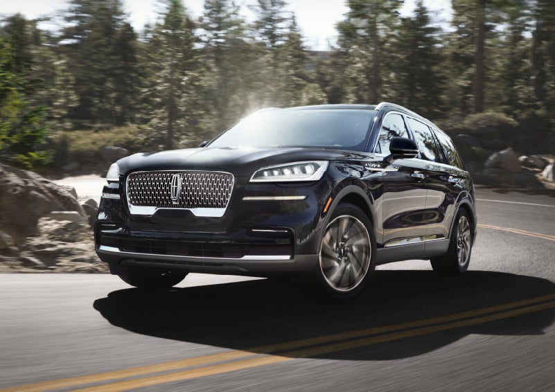 A Lincoln Aviator® SUV is being driven on a winding mountain road | Parkway Lincoln in Winston Salem NC