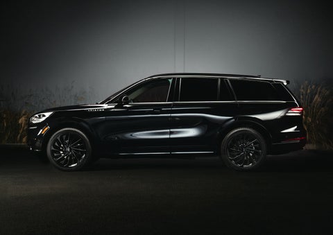 A 2024 Lincoln Aviator® SUV is shown in the Infinite Black exterior color | Parkway Lincoln in Winston Salem NC