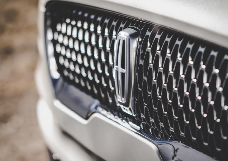 The grille of the 2024 Lincoln Aviator® Reserve model with an eye-catching repeated field of Lincoln Star logo shapes | Parkway Lincoln in Winston Salem NC