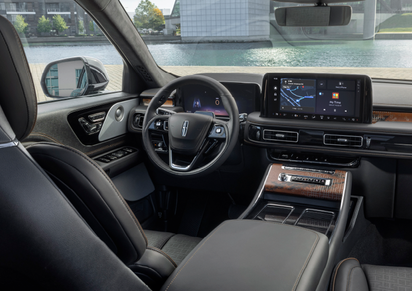 The interior of the 2025 Lincoln Aviator® SUV is shown parked with a view of a harbor through the windshield. | Parkway Lincoln in Winston Salem NC