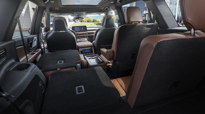 One side of the PowerFold® third-row seat and a second-row seat are folded forward in the 2026 Lincoln Aviator® SUV. | Parkway Lincoln in Winston Salem NC