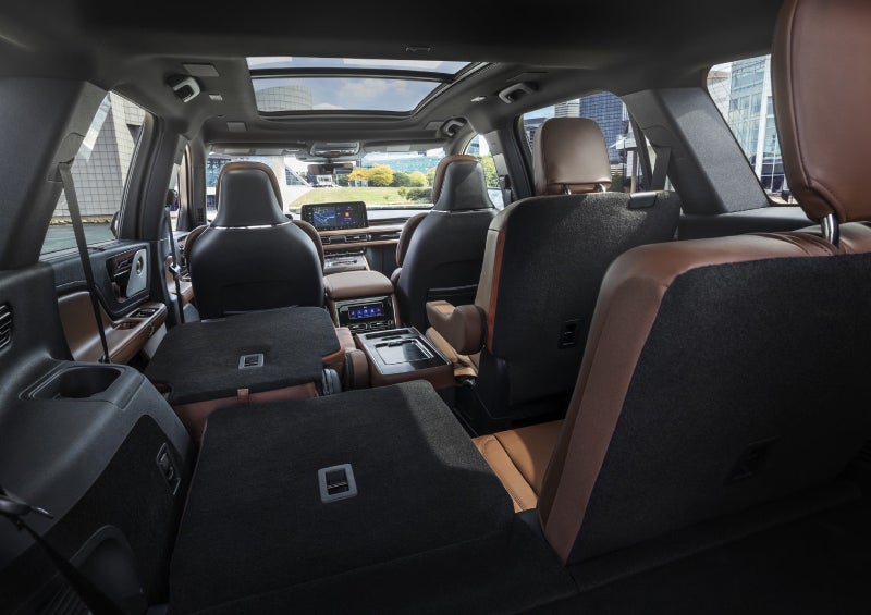 One side of the PowerFold® third-row seat and a second-row seat are folded forward in the 2026 Lincoln Aviator® SUV. | Parkway Lincoln in Winston Salem NC