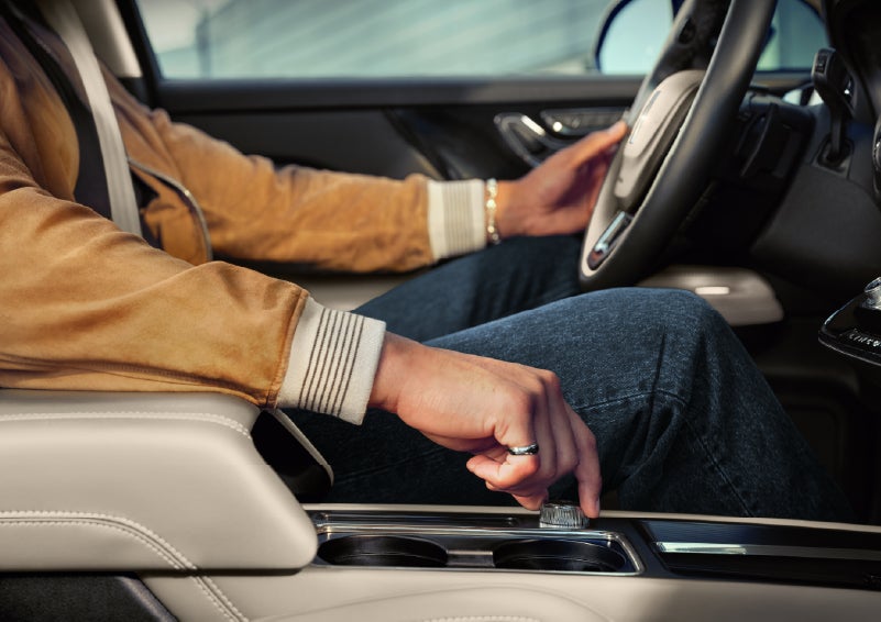 The driver of a 2026 Lincoln Corsair® SUV is shown selecting a drive mode. | Parkway Lincoln in Winston Salem NC