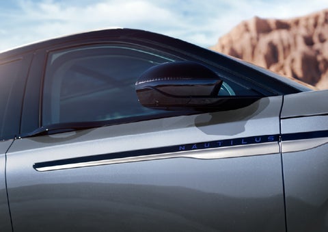 Blue lettering on the side of the vehicle that reads Nautilus indicates the available Hybrid Powertrain. | Parkway Lincoln in Winston Salem NC