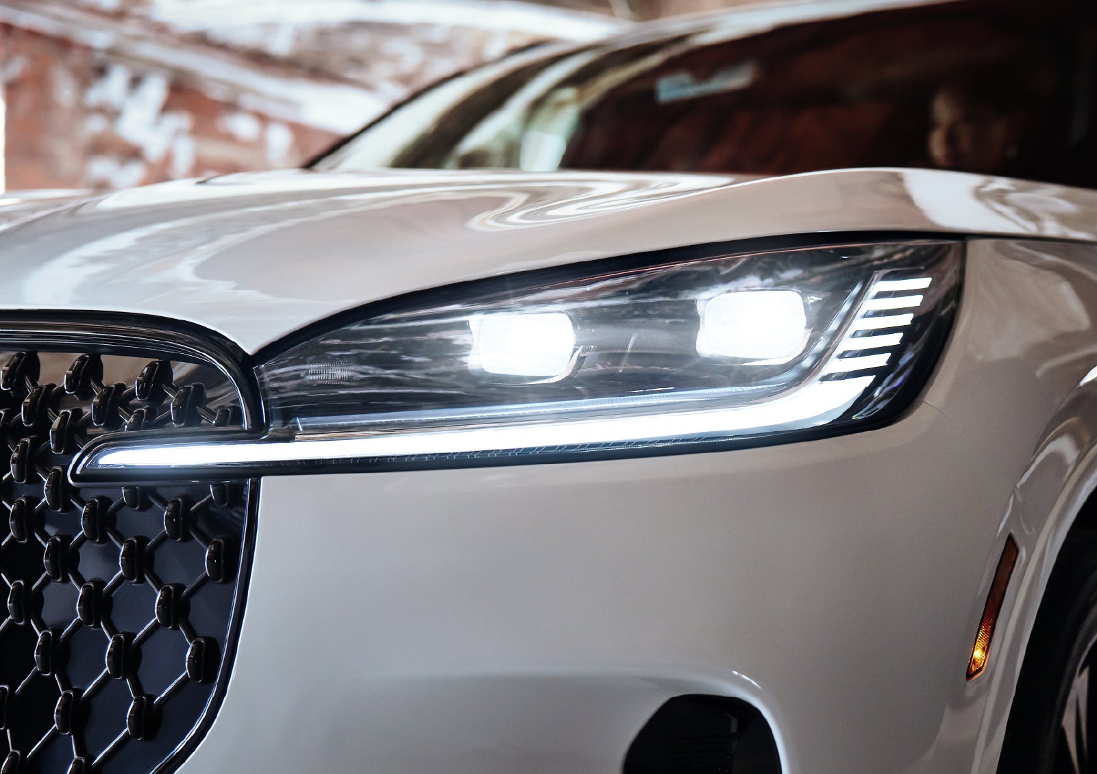 A close-up of a headlamp on the 2027 Lincoln Aviator® SUV is shown. | Parkway Lincoln in Winston Salem NC