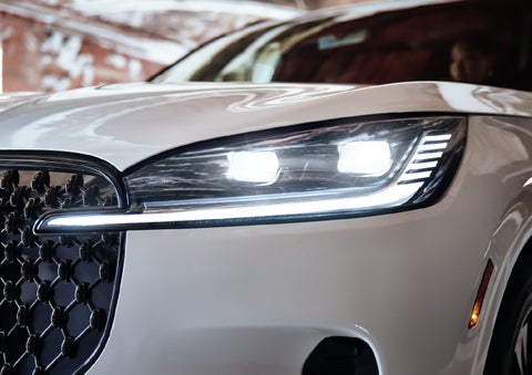A close-up of a headlamp on the 2027 Lincoln Aviator® SUV is shown. | Parkway Lincoln in Winston Salem NC