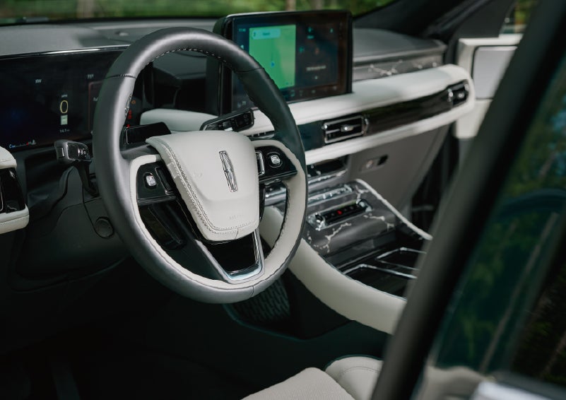 The leather-trimmed steering wheel of a 2027 Lincoln Aviator® Black Label™ SUV. | Parkway Lincoln in Winston Salem NC